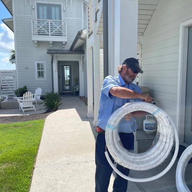 Aire Serv Technician Working Outside