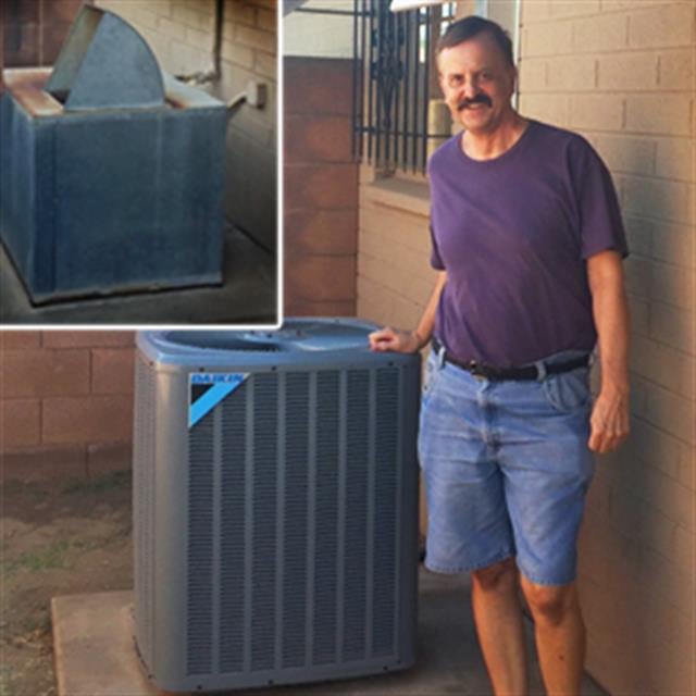 Customer in purple shirt standing next to a new AC unit with an image of an old unit