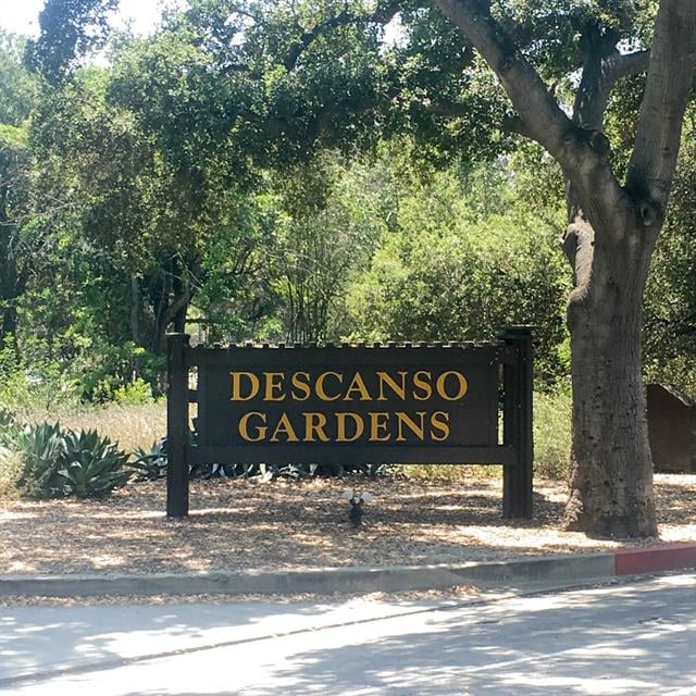 Descanto Gardens sign with trees in the background