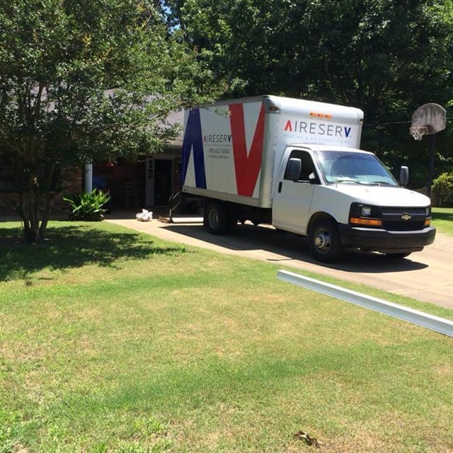 Aire Serv install truck at a customer's home