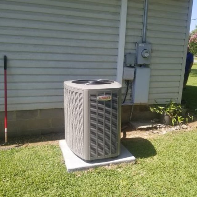 New Lennox 16 SEER air conditioner installed outside of house.