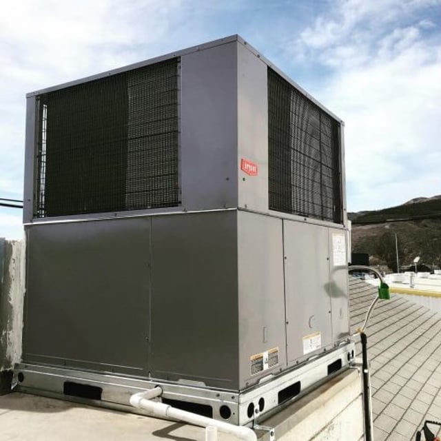 New rooftop package unit installed on roof.