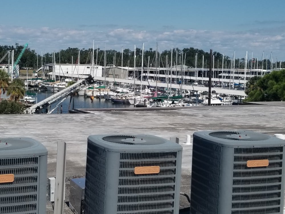 Three air conditioners enjoying a beautiful view of the water.