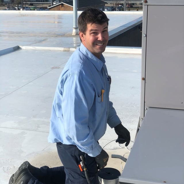 Smiling technician