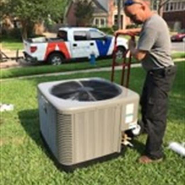 man working on ac unit