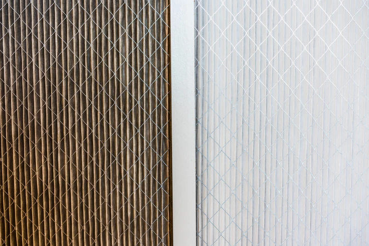 A side-by-side comparison of replacement air filters -- one dirty, one clean.