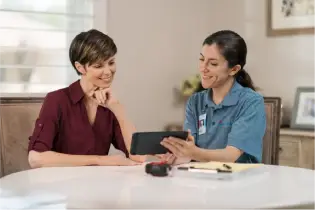 Two people researching what appliances qualify for  energy tax credits.