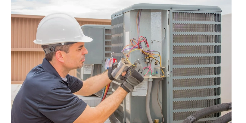 HVAC tech assessing HVAC unit