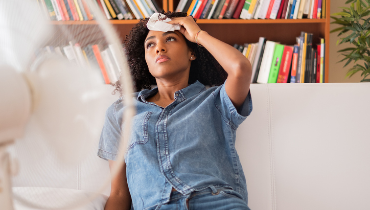 Hot woman in front of a fan | Aire Serv of Wilmington