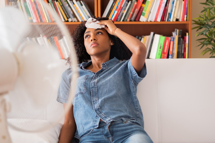 Hot woman in front of a fan | Aire Serv of Wilmington