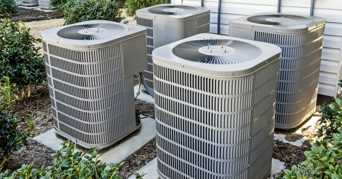 Group of new AC units outside a residential home.