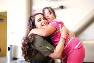 Two women hugging