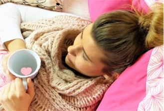 Woman relaxing on bed