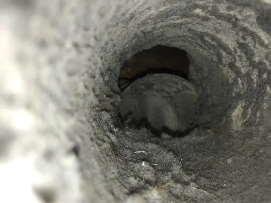 Air vent clogged with dust.