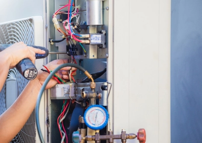 Close-up of technician completing repair on HVAC unit.