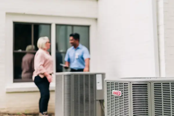 aireserv man repairing ac.