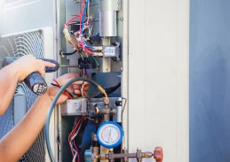 HVAC technician completing AC repair