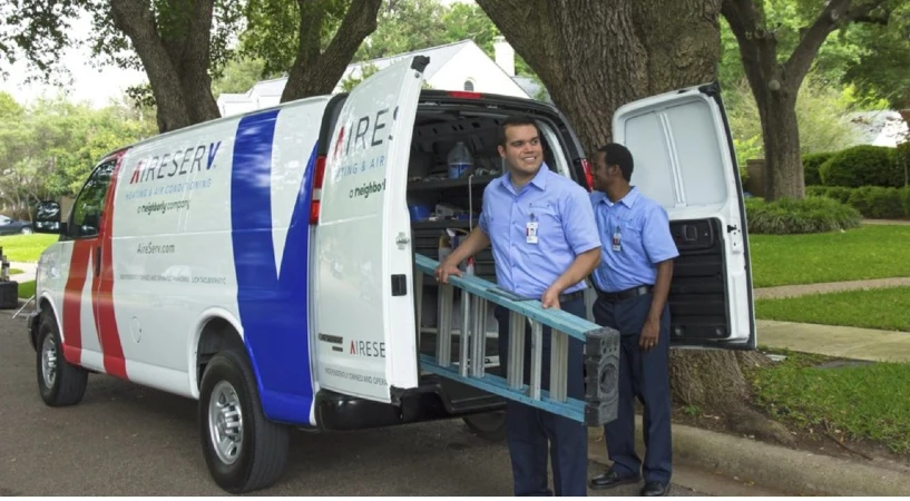 Aire Serv heating and cooling service professionals unloading van in Altoga.