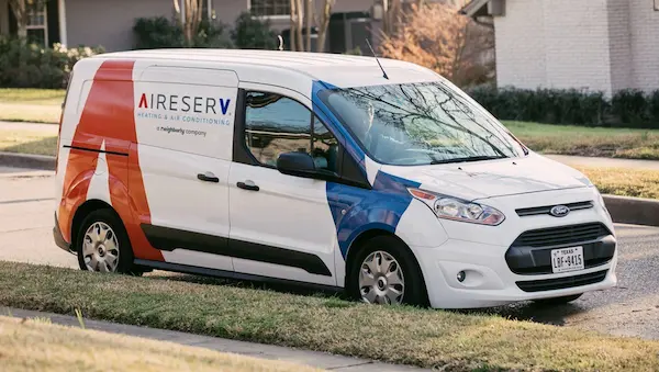 Aire Serv marked company van outside of McKinney home.